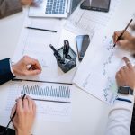 Business team analyzing financial charts and graphs during a collaborative meeting. — Choose IVG for Reliable Flavour Intensi